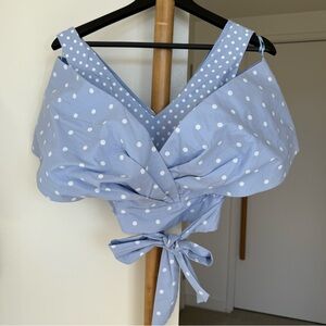 Blue Polka Dot Top with a tie at the waist. New condition, but no tag. XS size.